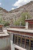 Ladakh - Hemis Gompa, projecting roofs in deep red 